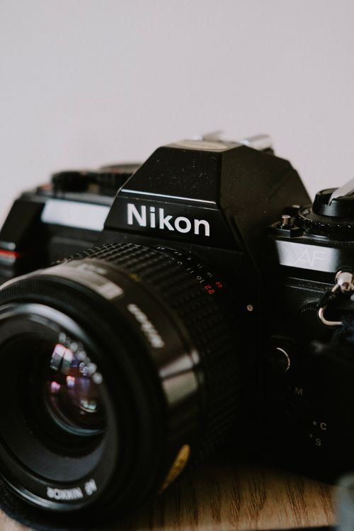 Free Close-up of a vintage Nikon camera and lens, perfect for photography enthusiasts. Stock Photo