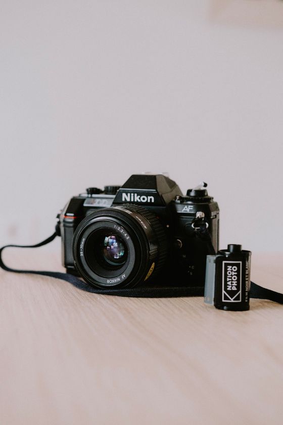 Nikon SLR with a roll of film