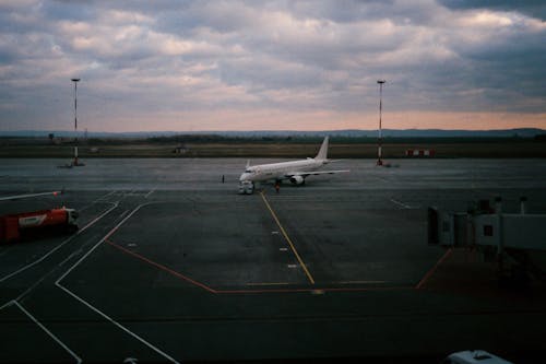 White Passenger Airplane on Airport