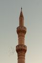 Brown Concrete Tower Under White Sky