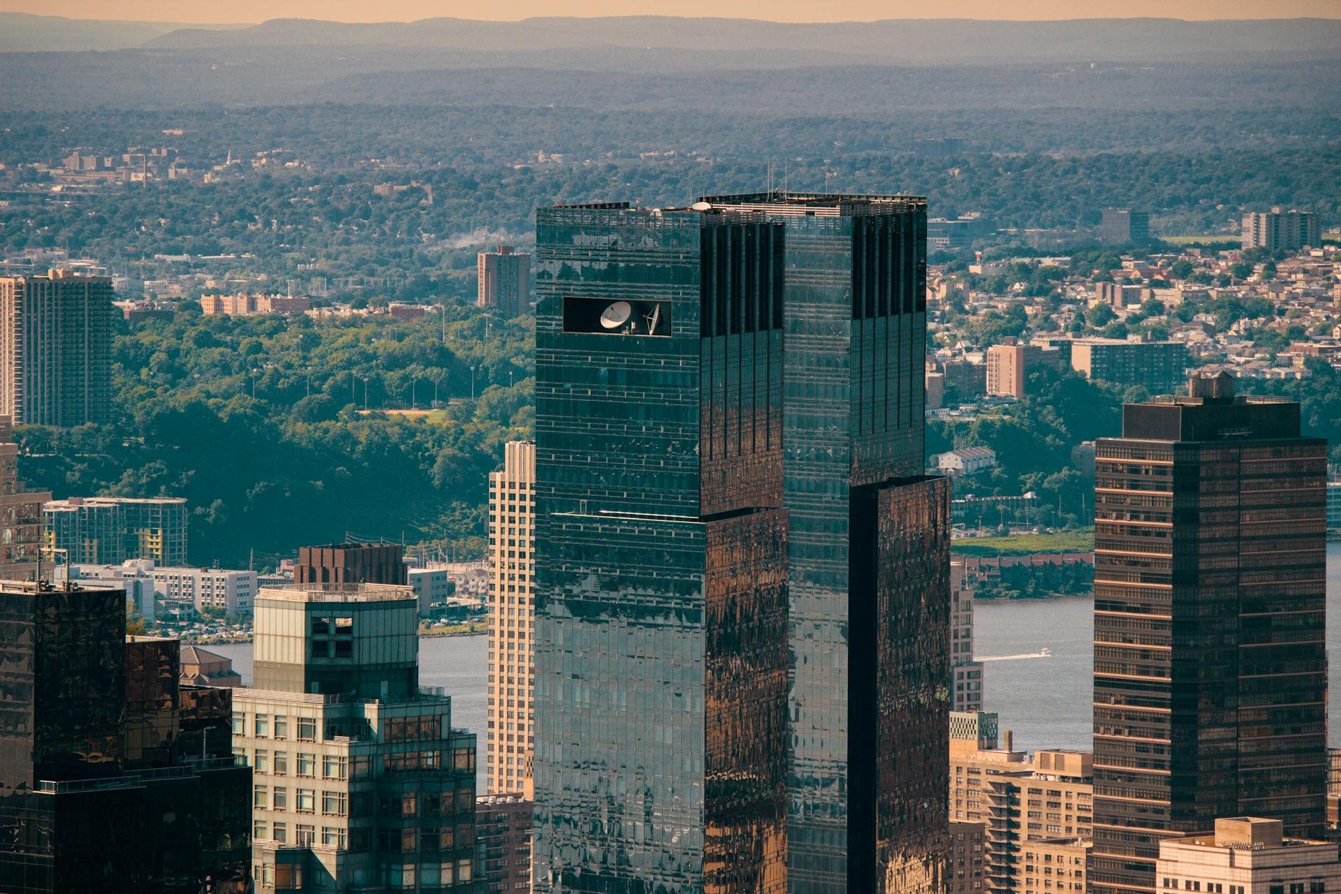 Aerial view of Manhattan skyline featuring the iconic Time Warner Center with the East River in the background.