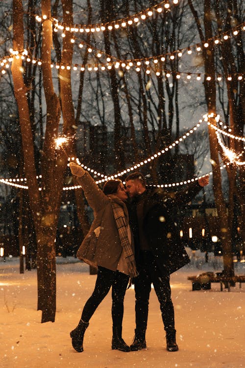Free Couple Kissing with Sparklers in their Hands  Stock Photo