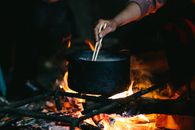 Person Holding Black Pot With Fire