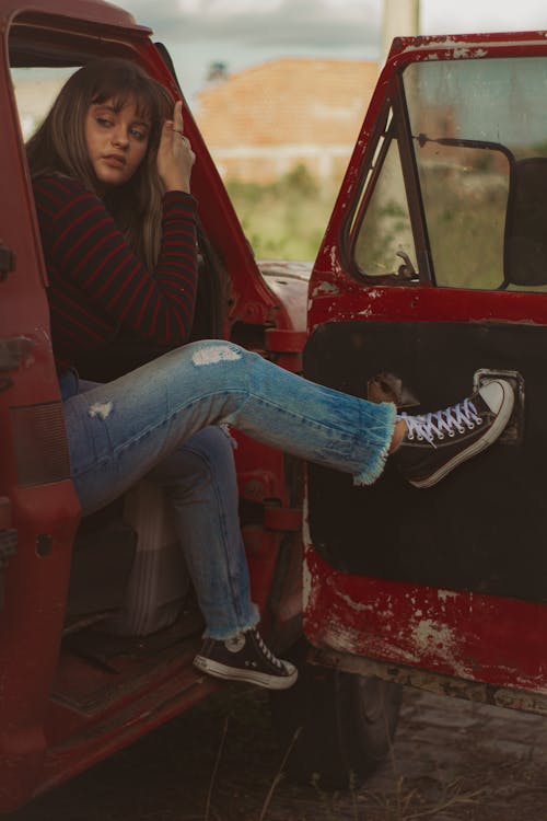 Woman Inside a Red Car