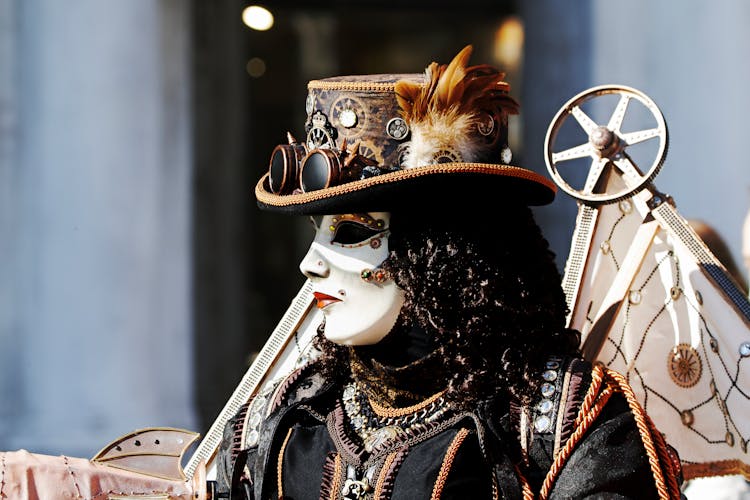 A Person In A Mask And Steampunk Outfit