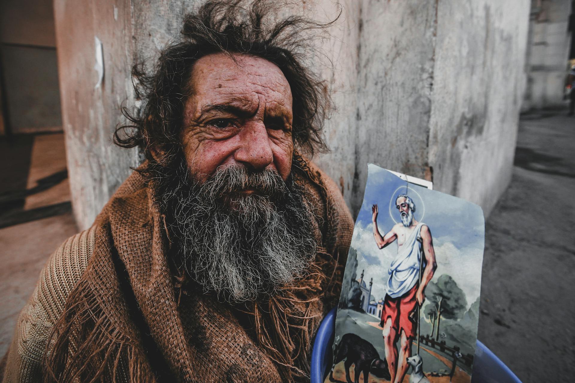 An Elderly Man with an Image of Saint Lazarus