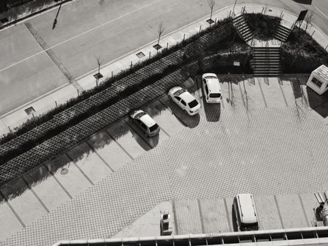 Grayscale Photo of a Parking Lot