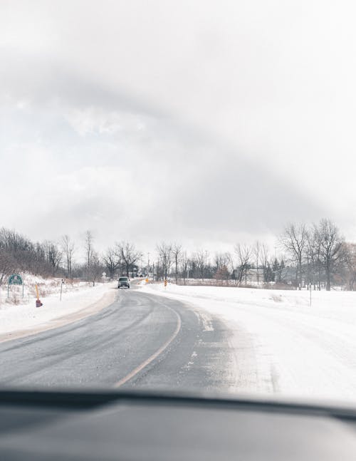 Moving Car on Snow Covered Road