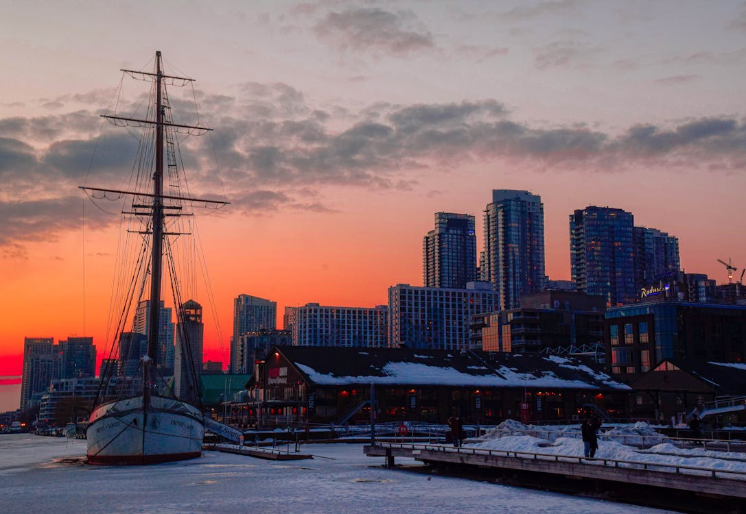 Ship on a Frozen River, and Skyscrapers at Sunrise