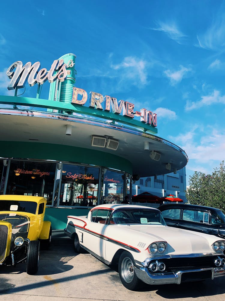 Classic Cars Parked In Front Of A Diner