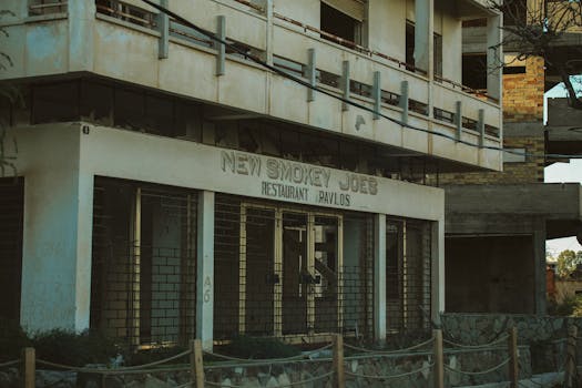 An eerie image of an abandoned restaurant with a decaying facade.