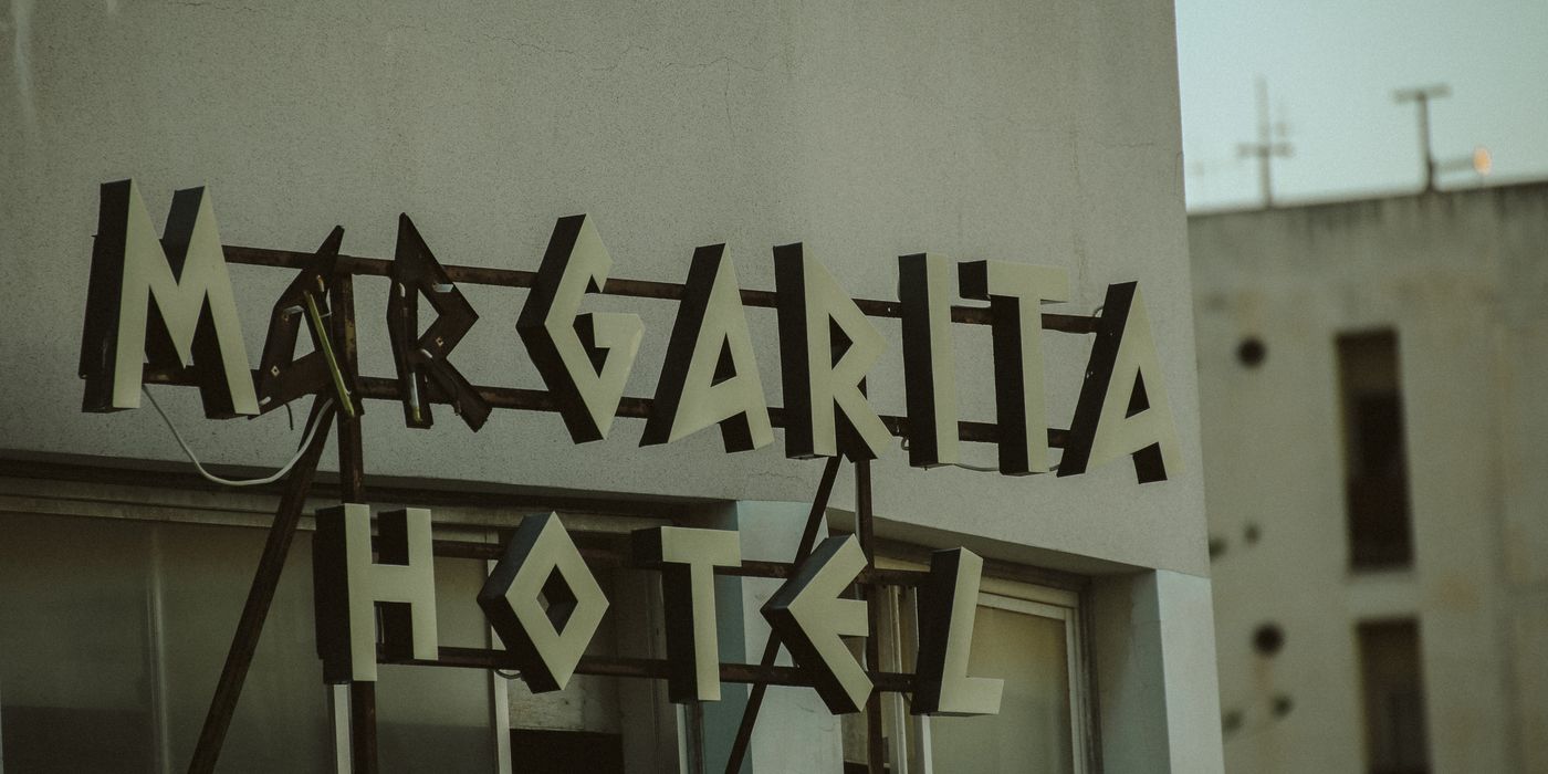 Retro illuminated sign for an independent hotel mounted on a building exterior