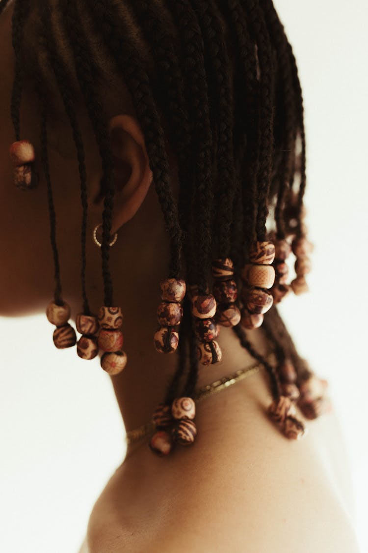 Close-up Shot Of A Braided Hair With Wooden Beads