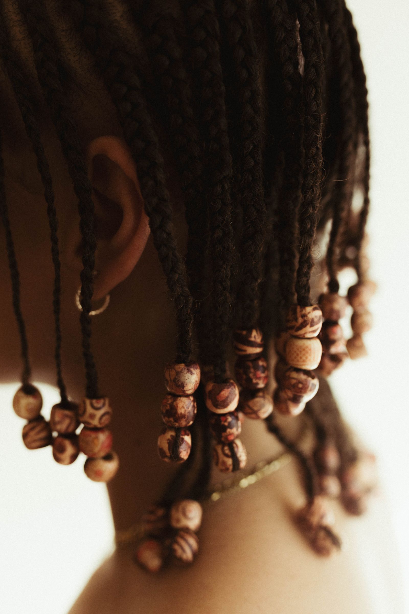 Beaded braided hairstyle inspired by Fulani styling