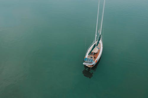 Aerial Photography Of Boat On Body Of Water