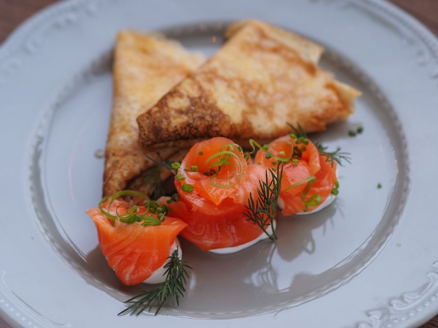 Crêpes served with smoked fish and fresh herbs — photo by Nadin Sh on Pexels
