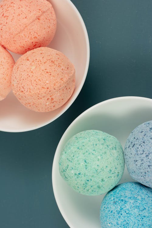 Colorful Bath Bombs on Ceramic Plates