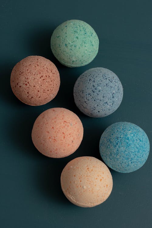 Colorful Bath Bombs on Blue Surface