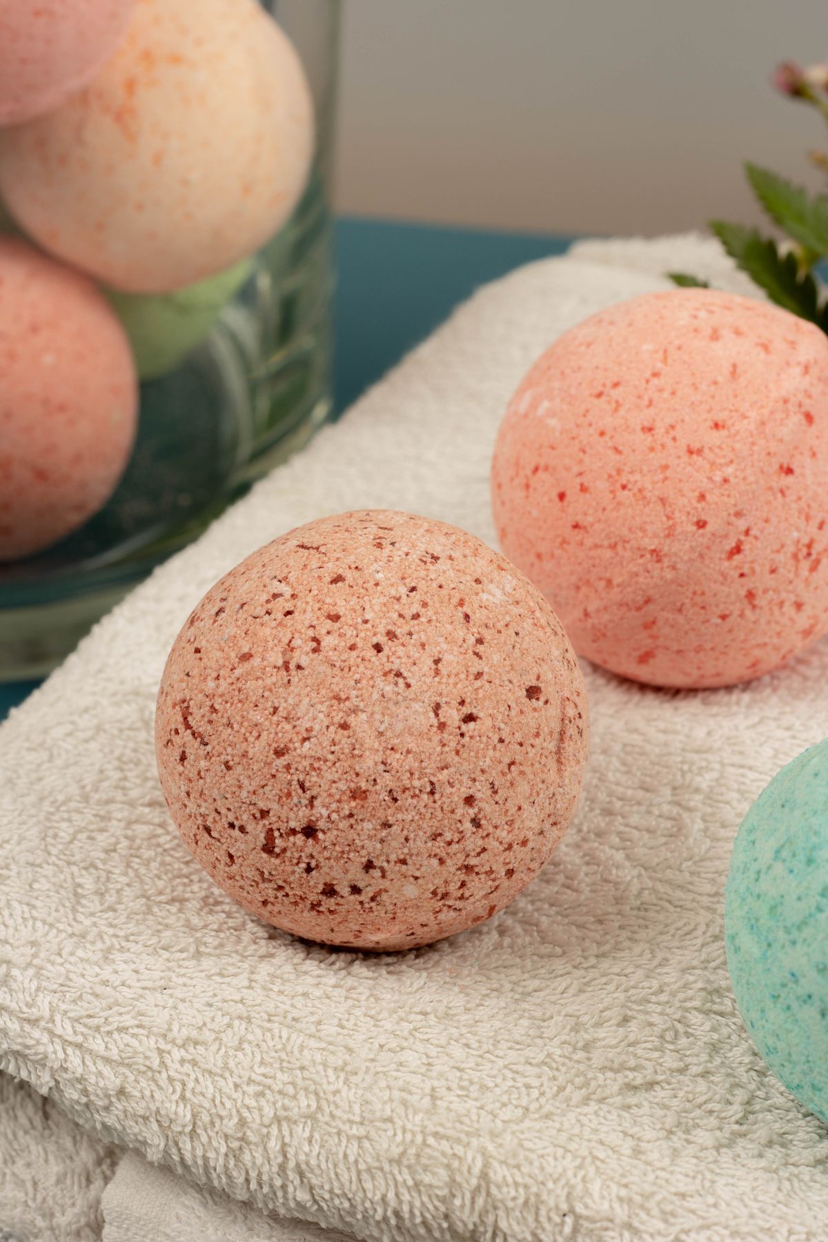 Pink bath bombs resting on a towel, self care minis for a homemade surprise bag