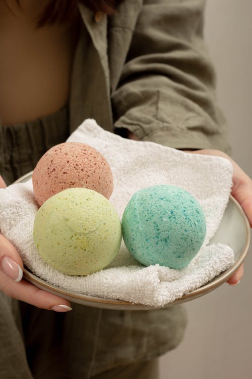 Close-Up Shot of a Person Holding Bath Bombs
