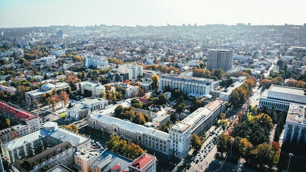 Stunning aerial view of a bustling urban cityscape with roads and buildings.