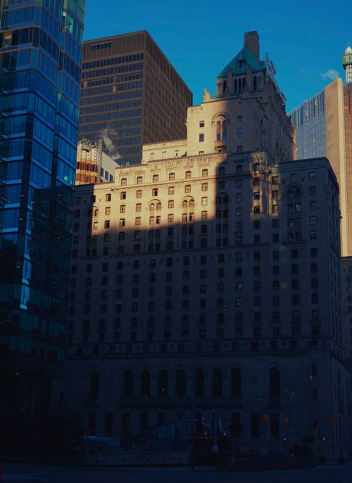 Free Historic architecture in Toronto blends with modern skyscrapers, highlighting urban contrast. Stock Photo