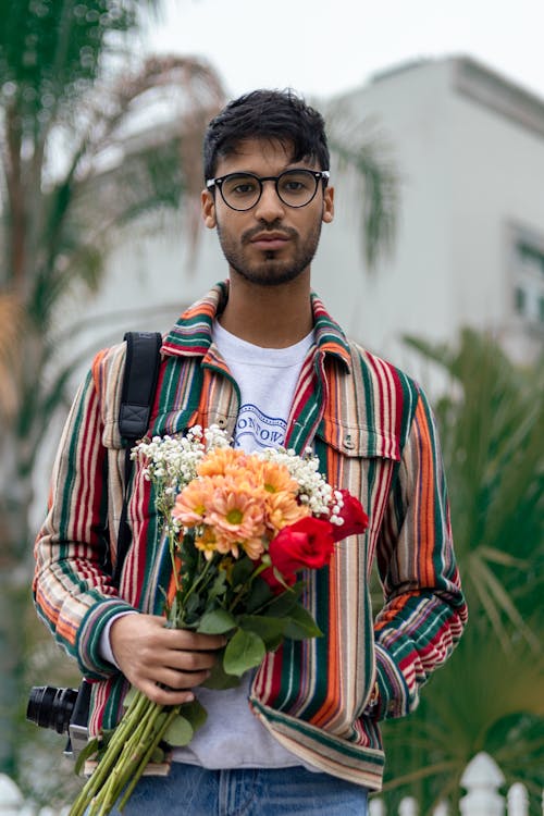 Man in Glasses Holding Bouquet f Flowers 