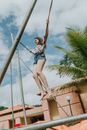 A Woman Midair on a Bungee Trampoline