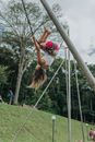 A Woman Doing a Backflip while on a Bungee Trampoline