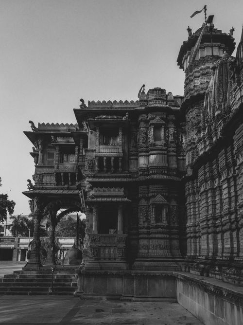 Free Black-and-white image capturing the detailed carving of a historic temple exterior. Stock Photo