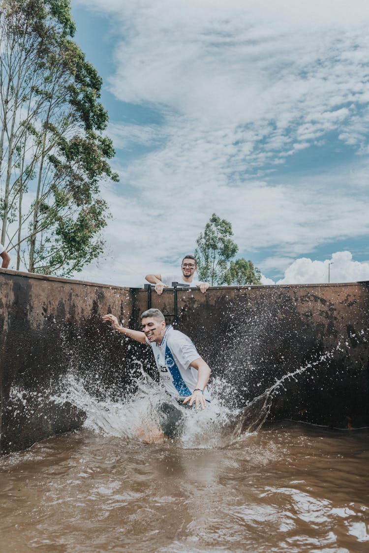 Young Man Falling Into Water With A Splash 