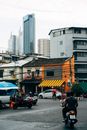 People Walking on Pedestrian Lane Near White Concrete Building