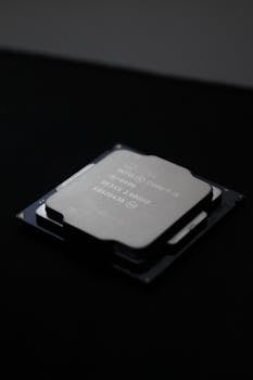 Detailed close-up image of a computer processor chip on a dark background.
