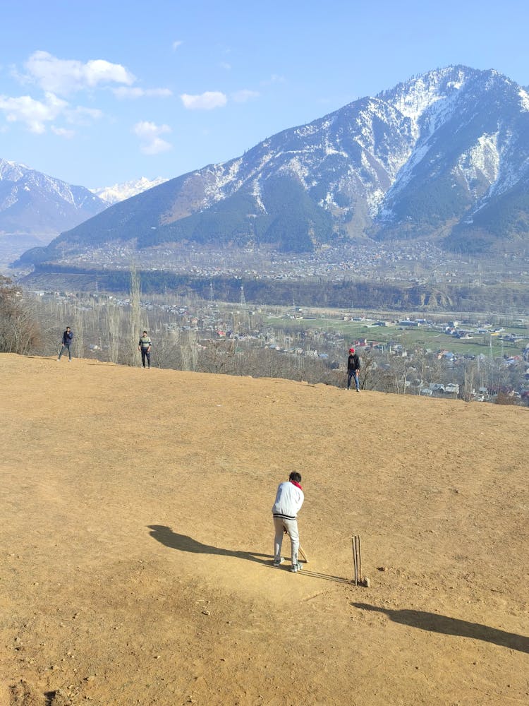 People Playing Cricket