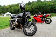 Red and Black Sports Bike Parked on Gray Concrete Road