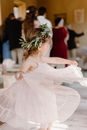 Woman in White Dress With Green and White Flower Crown