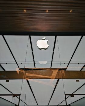 Reflection of a sleek architecture design with a prominent logo facade. 11274029
