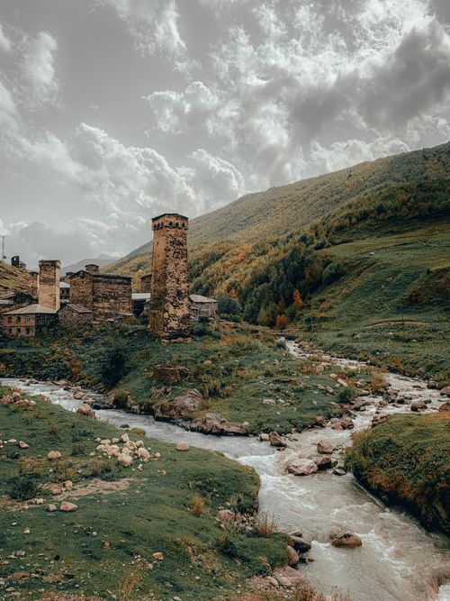 Free Explore the historic Svan towers against a lush mountainous backdrop in Ushguli, Georgia. Stock Photo