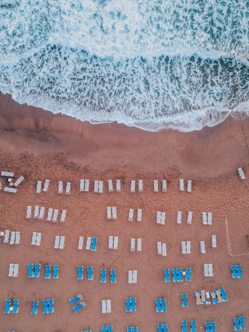 Free Directly Above View of Beach and Sea with Sun Loungers  Stock Photo