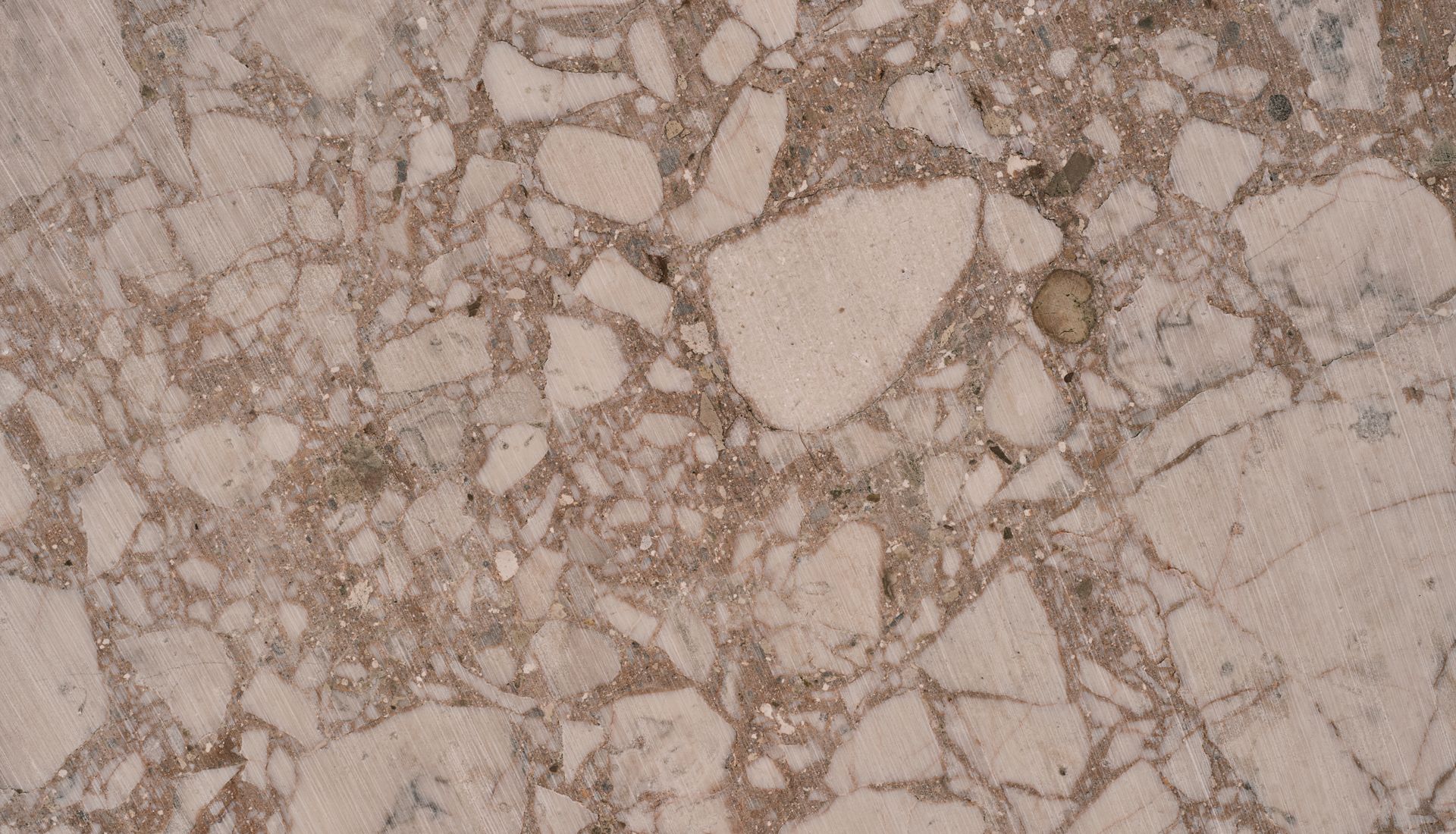 Close-up of natural marble stone texture in warm earthy tones