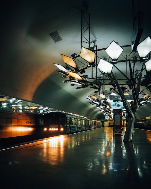 Dark Subway Station with Lamps and Reflections