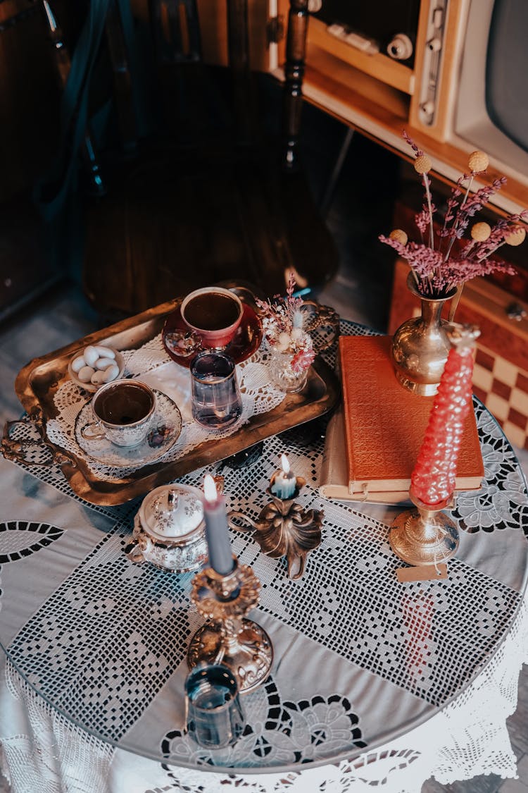 Tray With Two Cups Of Coffee Books On Table