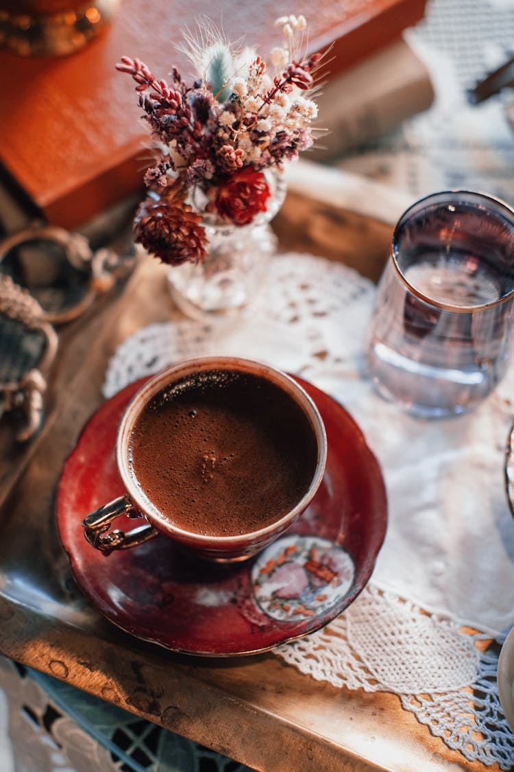 Cup Of Chocolate And Glass Of Water Standing On Tray