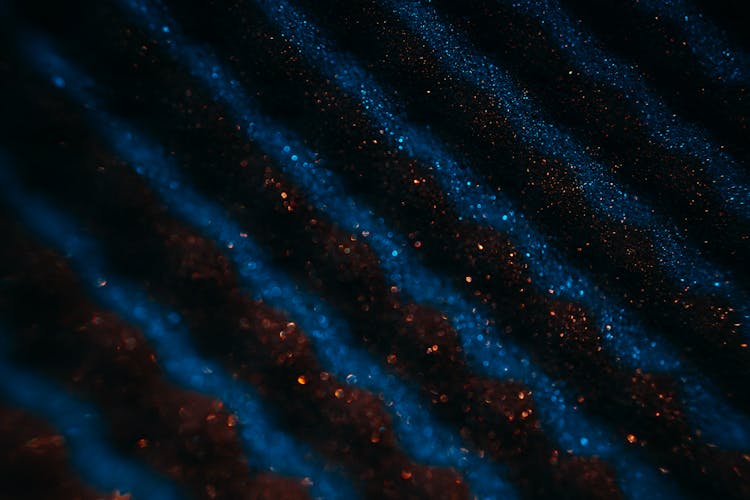 Red And Blue Glitters In Close-up Photography