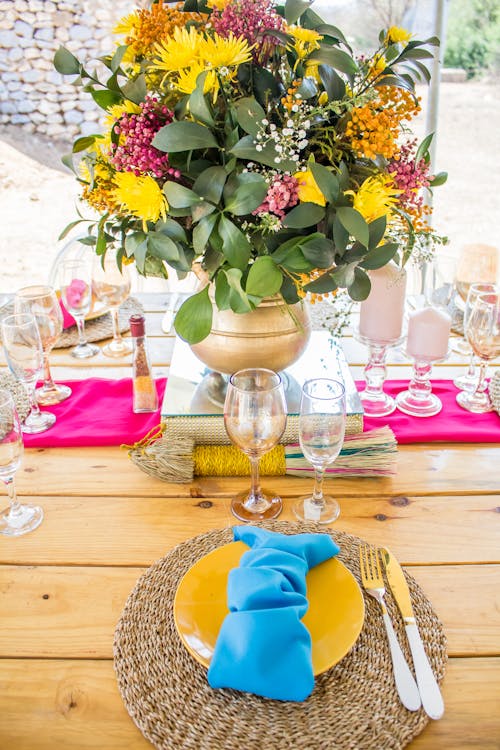 Free Table Setting, and a Flower Bouquet in a Vase Stock Photo