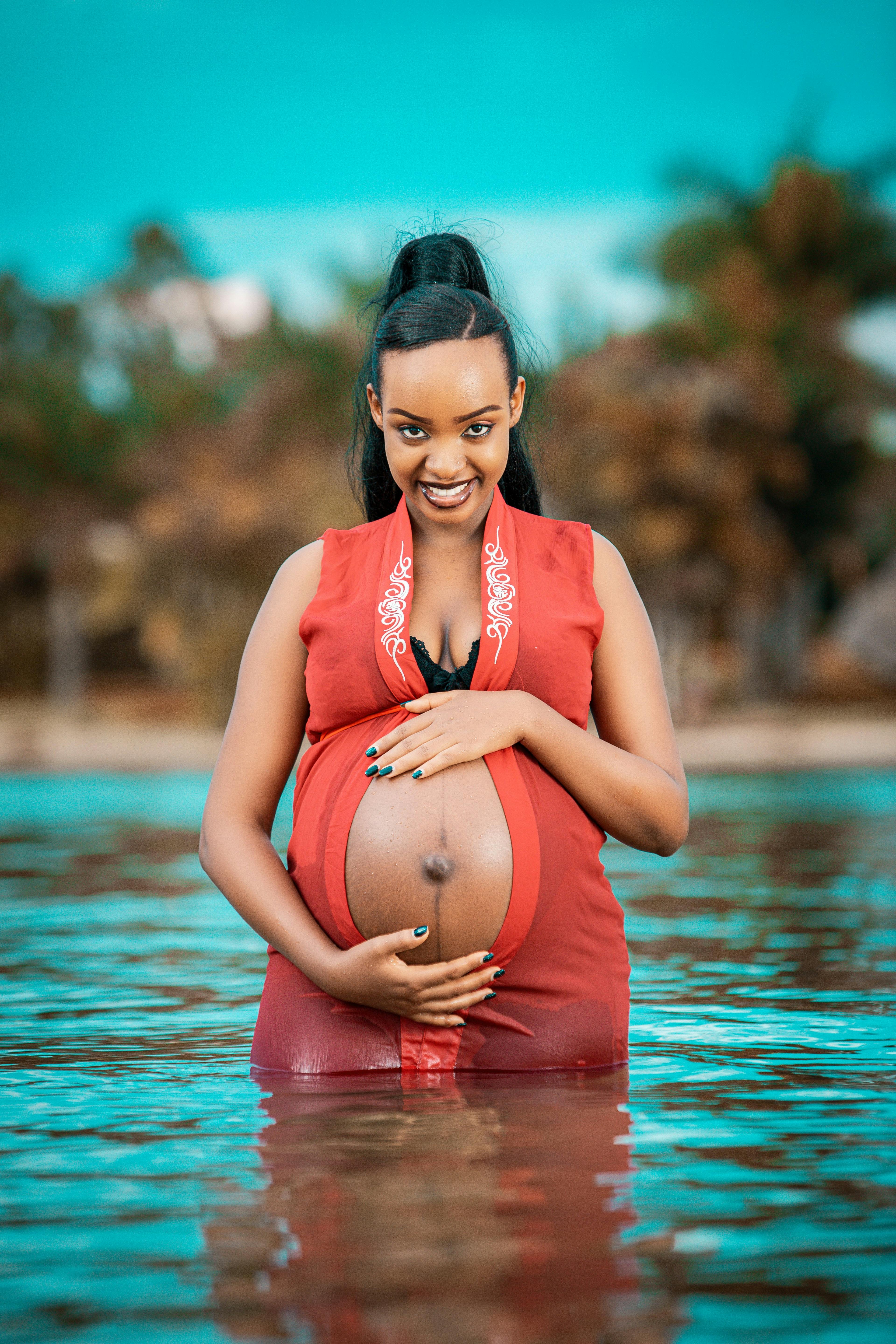 Pregnant Woman Standing in Water Bathing Outdoor Stock Image