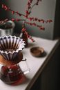 Brown Wooden Coffee Pot With White and Red Ribbon
