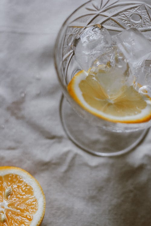 Lemon Slice and Ice Cubes on Cocktail Glass