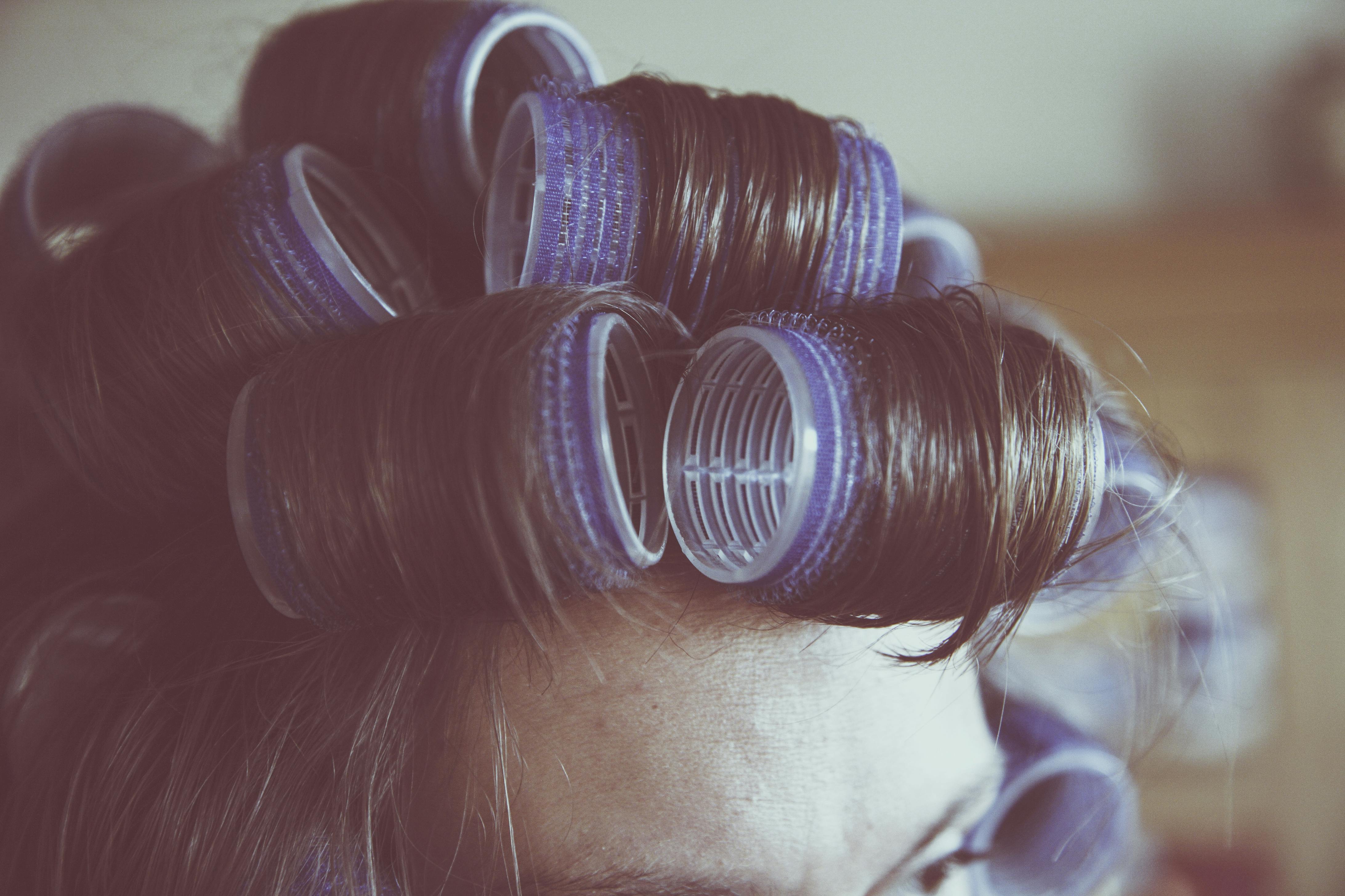 Woman Holding Gray Hair Dryer and Wearing White Bathrobe · Free Stock Photo