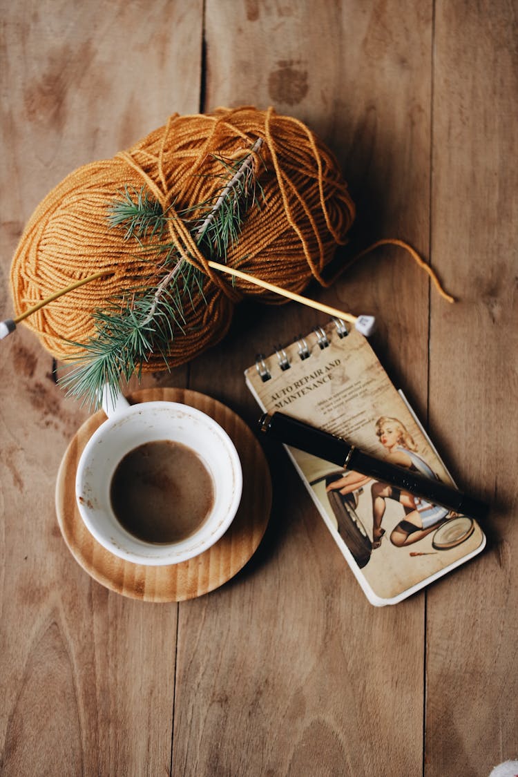 Skein Of Ginger Red Yarn Cup Of Coffee And Note Pad 